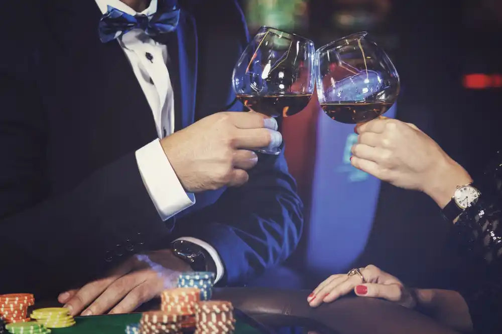 people in casino with wine glasses